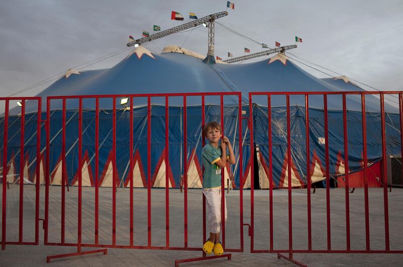 Abu Dhabi, United Arab Emirates, May 1, 2013: 
Eight-year-old Antonin Valla, the youngest of the Valla-Bertini circus family, and an aspiring magician, poses for a portrait in front of the Monte Carlo circus tent, as he plays outside while the performances go on, on Wednesday, May 1, 2013, at the circus new temporary location in Mussafah, an industrial subsection of Abu Dhabi. 
Silvia Razgova / The National
