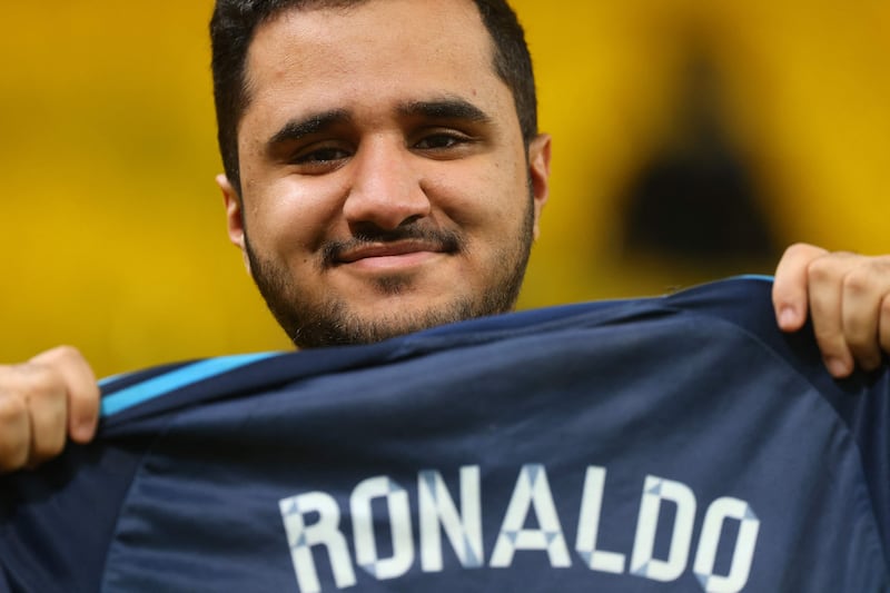 A supporter of Al Nassr with a Cristiano Ronaldo shirt. AFP