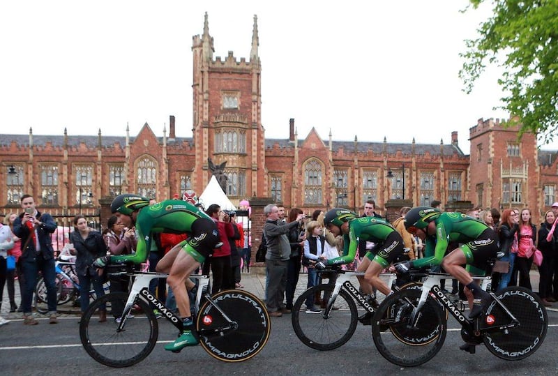 Team Europacar races past Queen's University Belfast during the first stage of the 2014 Giro d'Italia on Friday. Paul McErlane / EPA
