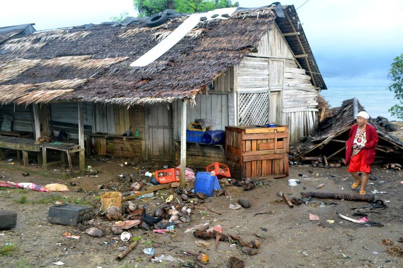 A local walks near her damaged house in Pandeglang. Reuters