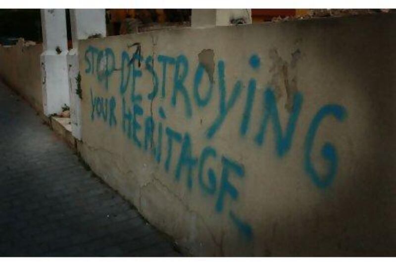 Graffiti in Beirut urging Lebanese to conserve historical buildings.