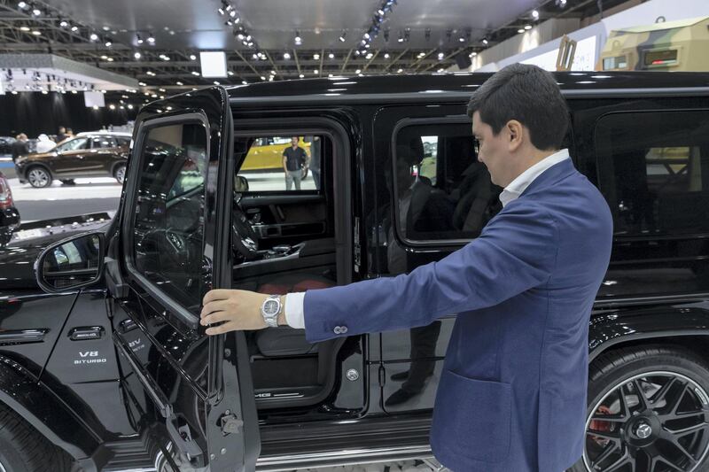 DUBAI, UNITED ARAB EMIRATES. 12 November 2019. Ulugbekhon Maksumov, Ceo of Inkas Vehicle LLC shows off one of their civilian models. Dubai Motor Show opening day. (Photo: Antonie Robertson/The National) Journalist: Nic Webster. Section: National.
