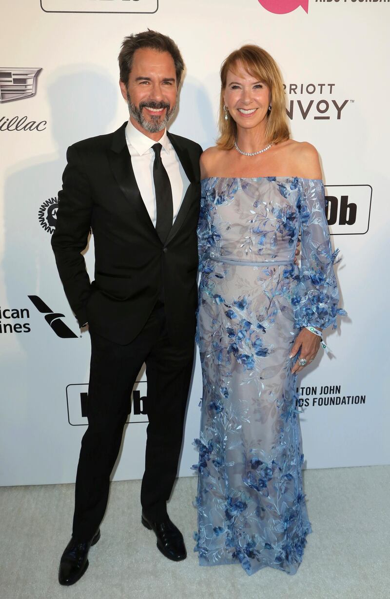 Eric McCormack and Janet Holden arrive at the 2019 Elton John AIDS Foundation Oscar Viewing Party on Sunday, February 24, 2019. AP