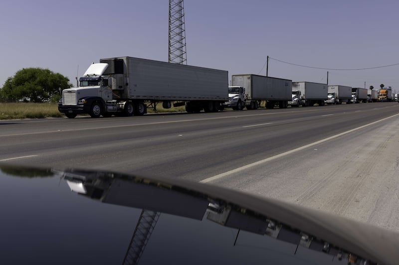 Hundreds of lorries wait in line to cross the Progreso International bridge into Mexico. AFP