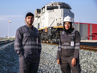 Sara Al Mazrouei and fellow Emirati train driver Ibrahim Al Hammadi. Victor Besa / The National