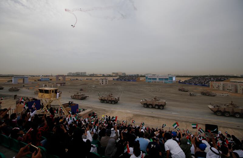 Spectators watch as members of the UAE armed forces perform. EPA