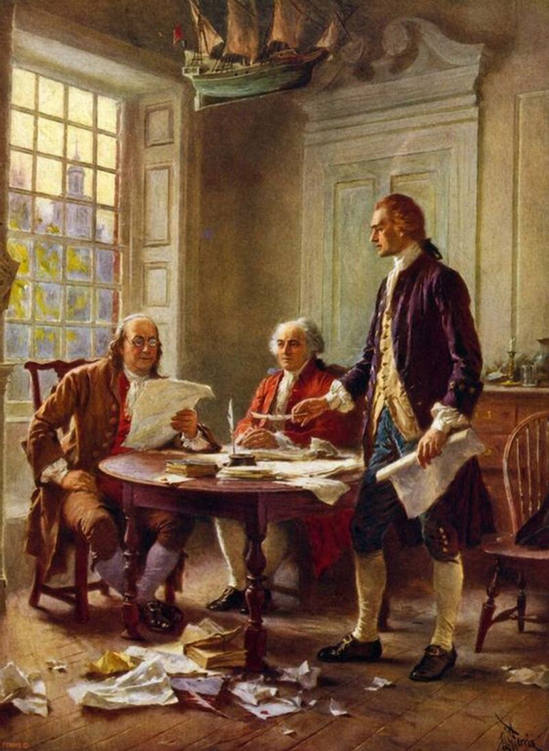 Writing the Declaration of Independence, 1776, by artist J L G Ferris (1863-1930). From left, Benjamin Franklin, John Adams and Thomas Jefferson review a draft in Philadelphia. Universal History Archive / Getty Images