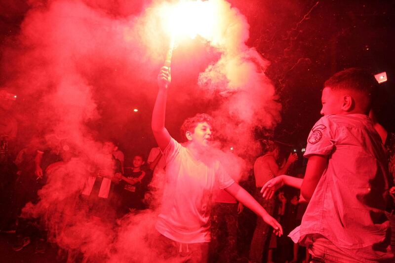 Algerian fans celebrate their national soccer team's 1-0 victory over Senegal in Africa's Cup of Nations final, in Algiers. AP