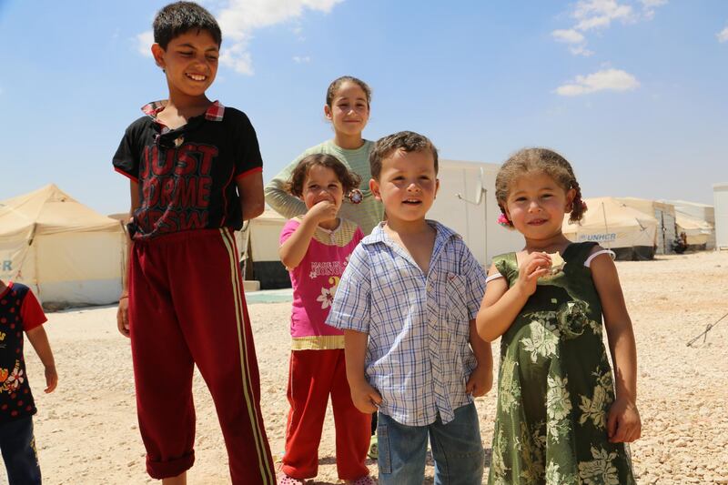 Jordan, Zaatari Refugee Camp, June 2013

On 29 July, the Zaatari camp in Marfaq, south of the Syrian border, became Jordan’s first official camp for Syrian refugees fleeing violence in their country. As Jordan continues to receive tens of thousands of Syrians, opening this camp had become necessary to accommodate terrified families.
On World Refugee Day, WFP PI Officer Dina El-Kassaby walked around the camp and spoke with refugees about their expectations and hopes for the future.

In the photo: Aya stands with her neighbours in Zaatari camp in Jordan. She is one of 60,000 children in Zaatari camp who miss something from home. Aya tells a WFP staffer that her mother promised her she could return home to Syria as soon as possible to collect her teddy bears and bring them back to Jordan where they can sleep with her in her tent in Zaatari camp.

Photo: WFP/Dina El-Kassaby