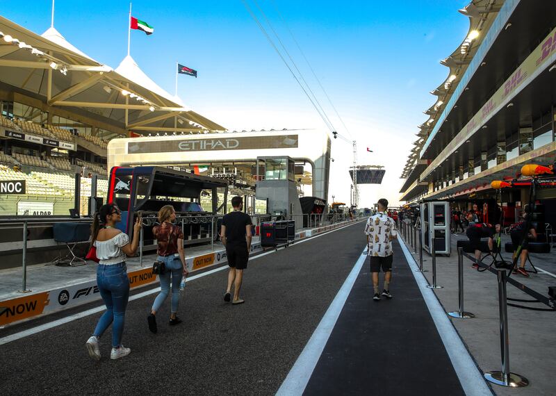 Fans walk on the tracks of Yas Marina Circuit. Victor Besa / The National
