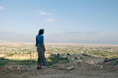Jericho, Palestine - March 16, 2010: Olga Vasilieva, 25, a tourist from Moscow, looks into the city of Jericho from the top of the Mount of Temptation.  ( Photo by Philip Cheung ) EDITORS NOTE: FOR M MAGAZINE