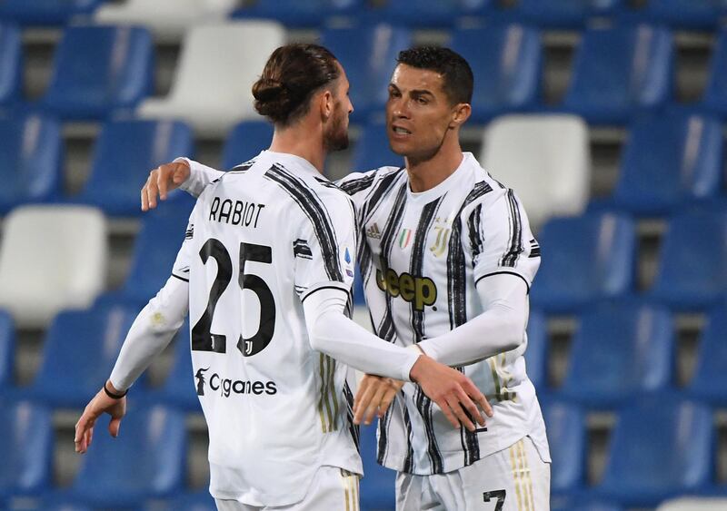 Juventus' Adrien Rabiot celebrates scoring their first goal against Sassuolo with Cristiano Ronaldo. Reuters