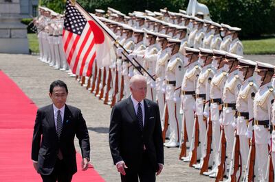 US President Joe Biden reviews an honour guard with Japanese Prime Minister Fumio Kishida during a welcome ceremony at the Akasaka State Guest House in Tokyo on Monday. Getty