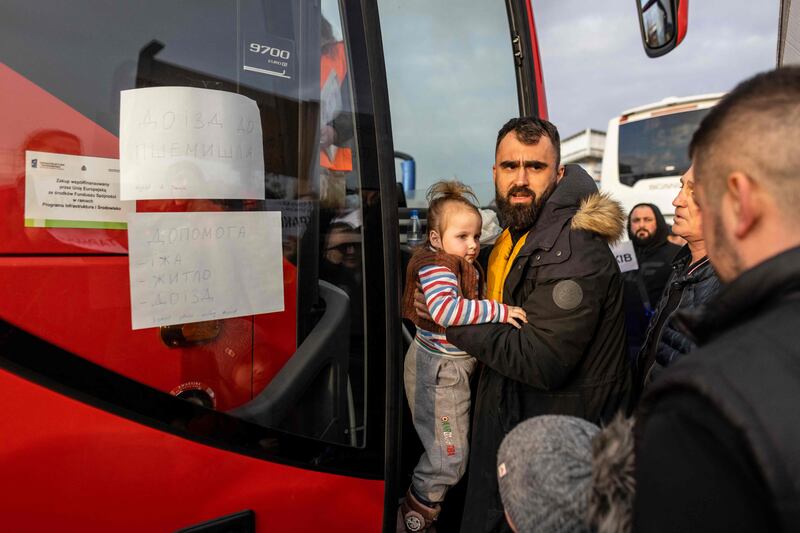 Refugees arrive with buses from the Medyka pedestrian border crossing, in Przemsyl, eastern Poland. AFP