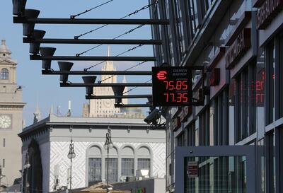 A digital screen displays foreign exchange rates outside an exchange bureau in Moscow, Russia, on Friday, Aug. 10, 2018. President Vladimir Putin’s efforts to protect Russia after past rounds of U.S. sanctions are leaving the economy more insulated even as the threat of further penalties rattles markets this week. Photographer: Andrey Rudakov/Bloomberg