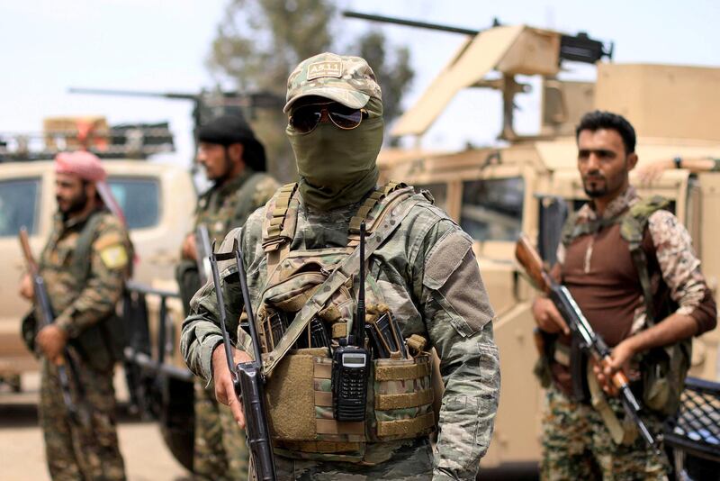 FILE PHOTO: Fighters of Syrian Democratic Forces (SDF) are seen in Deir al-Zor, Syria May 1, 2018. REUTERS/Rodi Said/File Photo