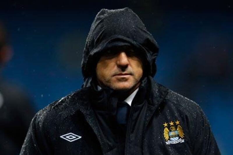 Manchester City and manager Roberto Mancini were knocked out the Capital One Cup.