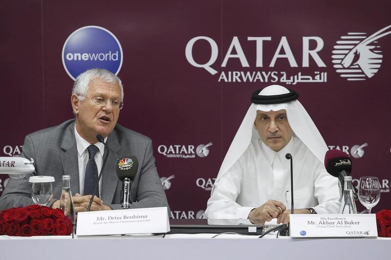Qatar Airways chief executive Akbar Al Baker, right, with Royal Air Maroc chairman Driss Benhima during the announcement of the two carriers' commercial partnership at the Arabian Travel Market in Dubai. Antonie Robertson / The National