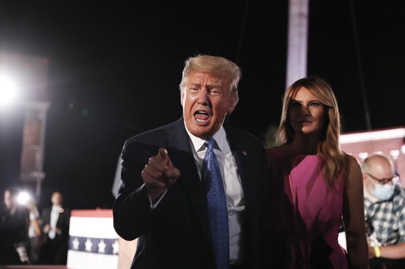 U.S. President Donald Trump, left, and U.S. First Lady Melania Trump greet attendees after a speech by U.S. Vice President Mike Pence. Bloomberg