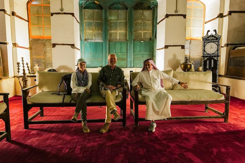 Reem Philby and Mark Evans sit with Sami Nawar as he gives a tour of the historic Nassif House building, where Ibn Saud was based for several years in old Jeddah