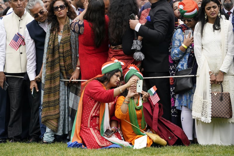 Indian Americans gather for the visit. AP