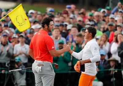 epa06656240 Rickie Fowler of the US (R) and Jon Rahm of Spain (L)  on the eighteenth hole during the final round of the 2018 Masters Tournament at the Augusta National Golf Club in Augusta, Georgia, USA, 08 April 2018. The 2018 Masters Tournament is held 05 April through 08 April 2018.  EPA/ERIK S. LESSER