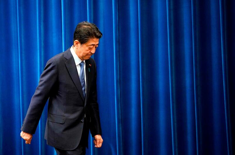Japanese Prime Minister Shinzo Abe walks out at the end of his press conference at the prime minister official residence in Tokyo on August 28 .Franck Robichon/ AFP/ Pool