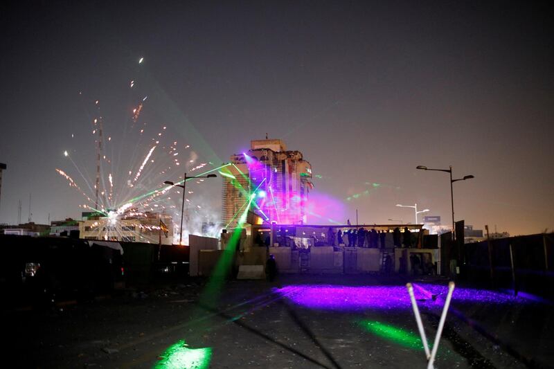Iraqi demonstrators use fireworks and laser during the ongoing anti-government protests in Baghdad, Iraq. Reuters