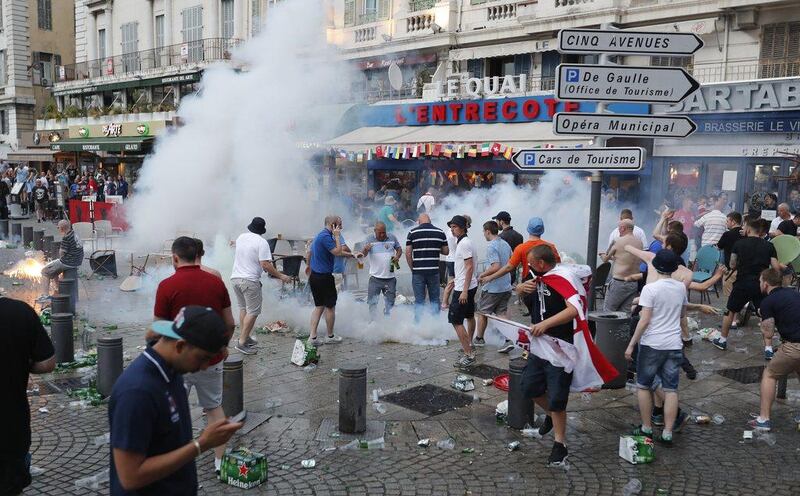 French police use tear gas against England supporters in downtown Marseille, France, Friday, June 10, 2016. AP Photo/Darko Bandic



