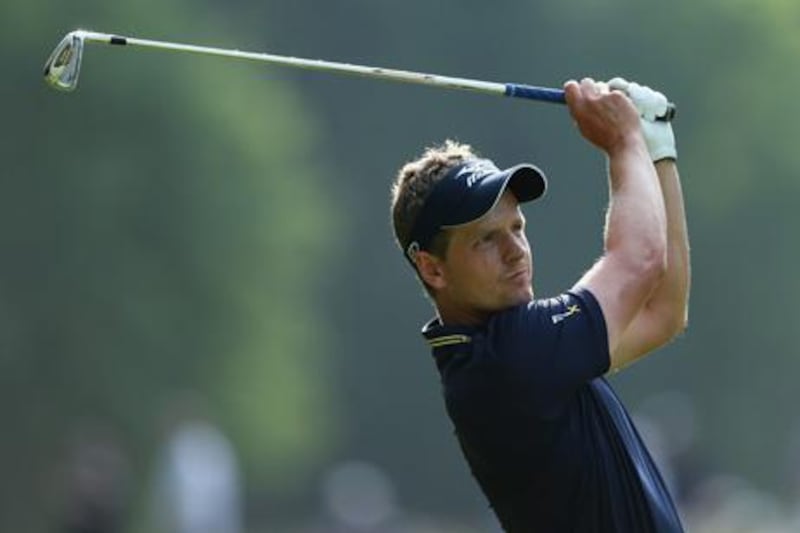 VIRGINIA WATER, ENGLAND - MAY 27:  Luke Donald of England plays his second shot on the 17th hole during the final round of the BMW PGA Championship on the West Course at Wentworth on May 27, 2012 in Virginia Water, England.  (Photo by David Cannon/Getty Images)