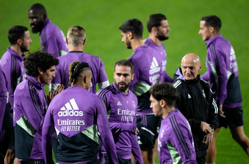Real Madrid's Dani Carvajal, centre, speaks with his teammate Mariano Diaz, during a training session. AP Photo