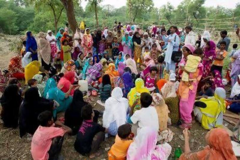 Pakistani Christians from a neighbourhood where a girl was arrested on blasphemy charges pray in a clearing of an urban forest in Islamabad on Monday.