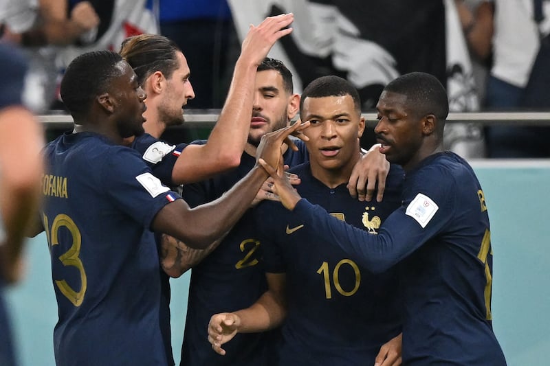 France forward Kylian Mbappe celebrates with teammates after scoring his team's second goal. AFP