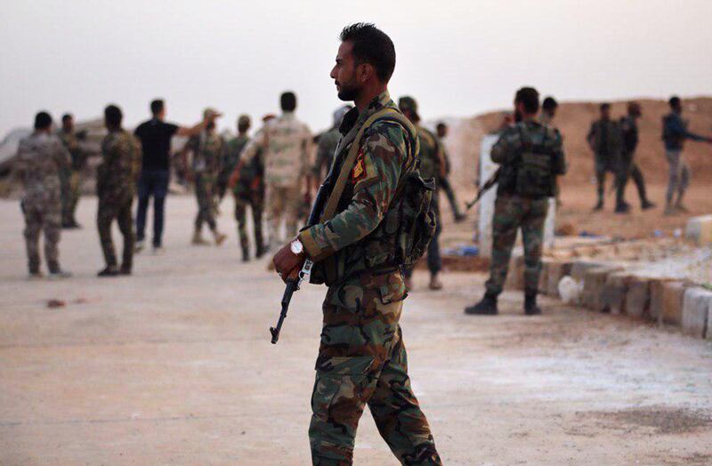 A handout picture released by the official Syrian Arab News Agency (SANA) shows Syrian government forces gathering AT Tabqa air base in Syria's Raqqa region. The Syrian regime sent troops towards the Turkish border today to contain Ankara's deadly offensive against the Kurds, stepping in for US forces due to begin a controversial withdrawal. AFP