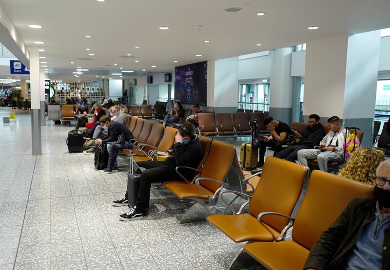 Passengers in a waiting lounge at Bristol Airport on October 3 ahead of the relaxation of travel rules in the UK.  Getty Images