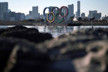 The Olympic rings floating in the water in the Odaiba section is seen in Tokyo Wednesday, Jan. 20, 2021. Tokyo organizers and the IOC on Wednesday began explaining in public how they hope to to pull off the globe's largest mega-sports event in the middle of a pandemic by rolling out so-called “Playbooks"to detail the ways that 15,400 Olympic and Paralympic athletes will enter Japan — and exit Japan — with the Olympics opening on July 23 and the Paralympics a month later. (AP Photo/Eugene Hoshiko)