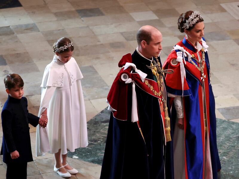Princess Charlotte and Prince Louis follow their parents into Westminster Abbey. AP