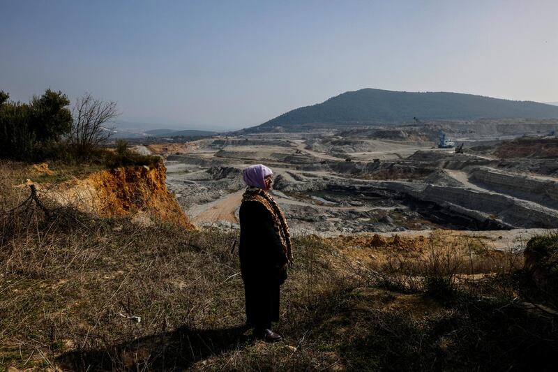 Tayyibe Demirel stands in her olive grove and views the nearby open pit coal mine at Turgut village, near Yatagan, in Mugla province, Turkey. 'Three or four years ago, this demolished land was full of tulips, poppies and daisies,' she said. Reuters