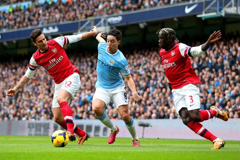 Arsenal's performance in a 6-3 loss to Samir Nasri, centre, and Manchester City raised some old questions about the London club's ability to see out the season and win the league. Clive Brunskill / Getty Images