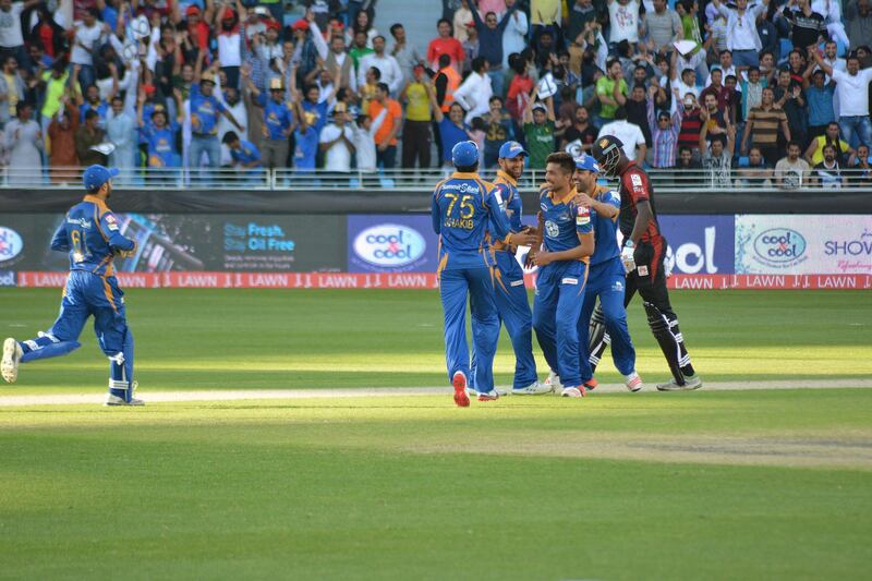 Caption: Mohammed Amir and the Karachi Kings celebrate the bowler's hat-trick against Lahore Qalanders at the Dubai International Stadium on February 5, 2016. Courtesy Pakistan Cricket Board. *** Local Caption ***  sp06fe-p8-psl.jpg