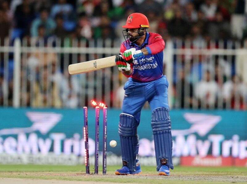 Afghanistan batter Mohammad Nabi is bowled by Pakistan's Naseem Shah for a duck.