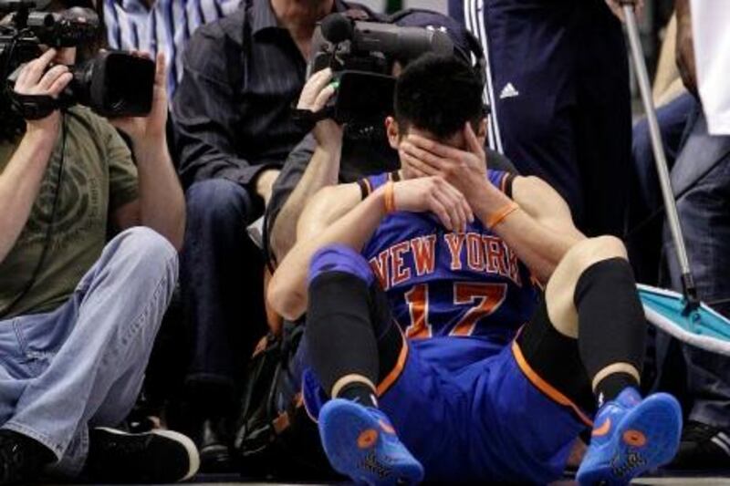 FILE - In this March 6, 2012, file photo, New York Knicks' Jeremy Lin reacts after being fouled during an NBA basketball game against the Dallas Mavericks in Dallas. Lin is having left knee surgery and will miss six weeks, likely ending his amazing breakthrough season.  The team said Saturday, March 31, 2012, the point guard had an MRI exam this week that revealed a small, chronic meniscus tear.   (AP Photo/Tony Gutierrez, File) *** Local Caption ***  Knicks Lin Basketball.JPEG-0f753.jpg