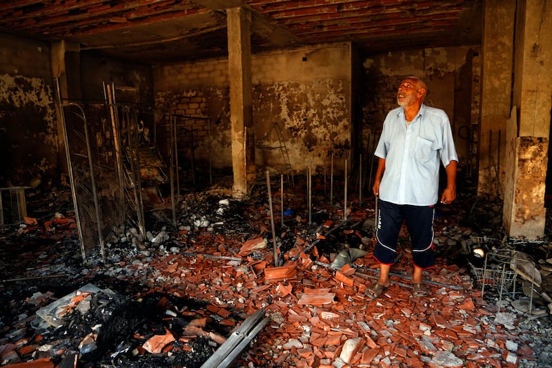 A man surveys the damage from clashes in the Libyan capital of Tripoli. AP