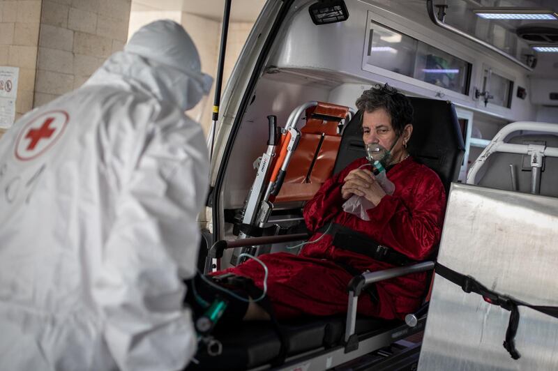 ©2021 Tom Nicholson. 23/01/2021. Jounieh, Lebanon. A patient with Coronavirus is transferred from a Lebanese Red Cross ambulance to a hospital in the Jounieh region. Today Lebanon registered 4176 new Coronavirus cases, and 52 deaths. Tom Nicholson for The National