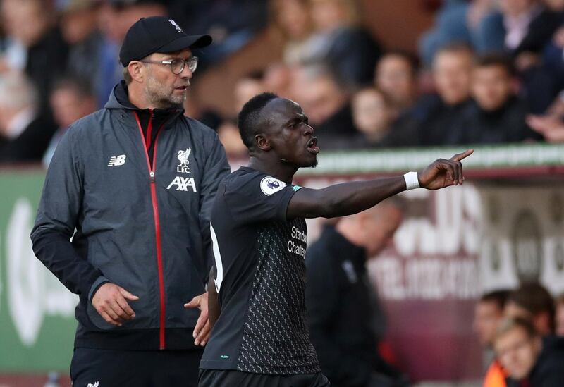 Soccer Football - Premier League - Burnley v Liverpool - Turf Moor, Burnley, Britain - August 31, 2019  Liverpool's Sadio Mane reacts after being substituted off as manager Juergen Klopp looks on  Action Images via Reuters/Carl Recine  EDITORIAL USE ONLY. No use with unauthorized audio, video, data, fixture lists, club/league logos or "live" services. Online in-match use limited to 75 images, no video emulation. No use in betting, games or single club/league/player publications.  Please contact your account representative for further details.