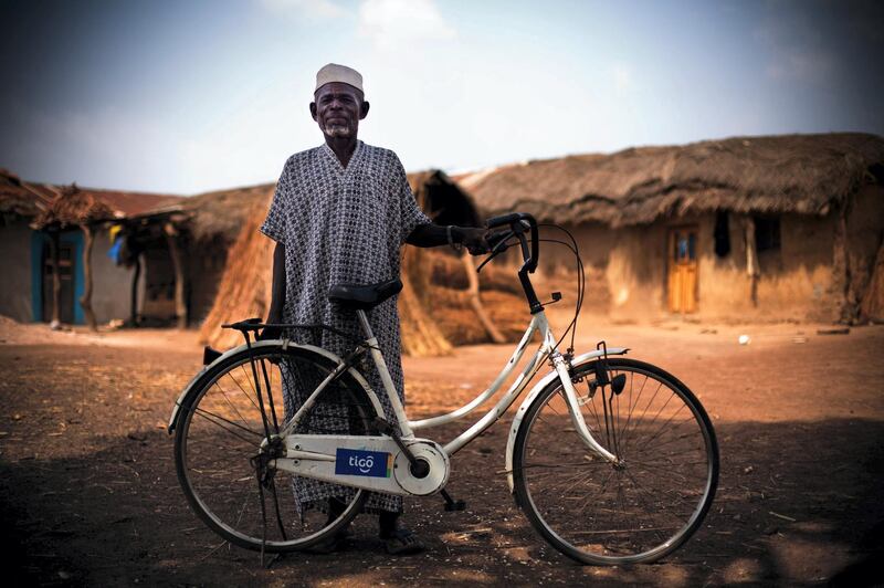 BTH81W An elderly man poses with his bicycle in Salaga, northern Ghana on Thursday March 26, 2009.