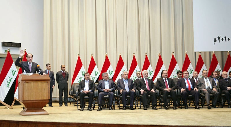 December 21, 2010:  Iraqi Prime Minister Mr Al Maliki (L) and members of his newly formed cabinet attend a voting session at the Iraqi Parliament in Baghdad, Iraq. The new government was unanimously approved, ending nine months of deadlock. Getty