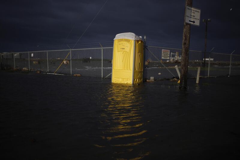 A portable toilet is surrounded by floodwater ahead of Hurricane Laura in Sabine, Texas, US. Bloomberg