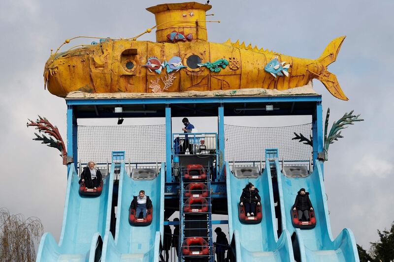 Members of the public ride on the Depth Charge water slide ride at Thorpe Park theme park in Chertsey. AFP