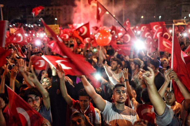 People gather to celebrate in Istanbul’s Taksim Square, in July, after the failed military coup in which 290 people died. Kursat Bayhan / Getty Images.